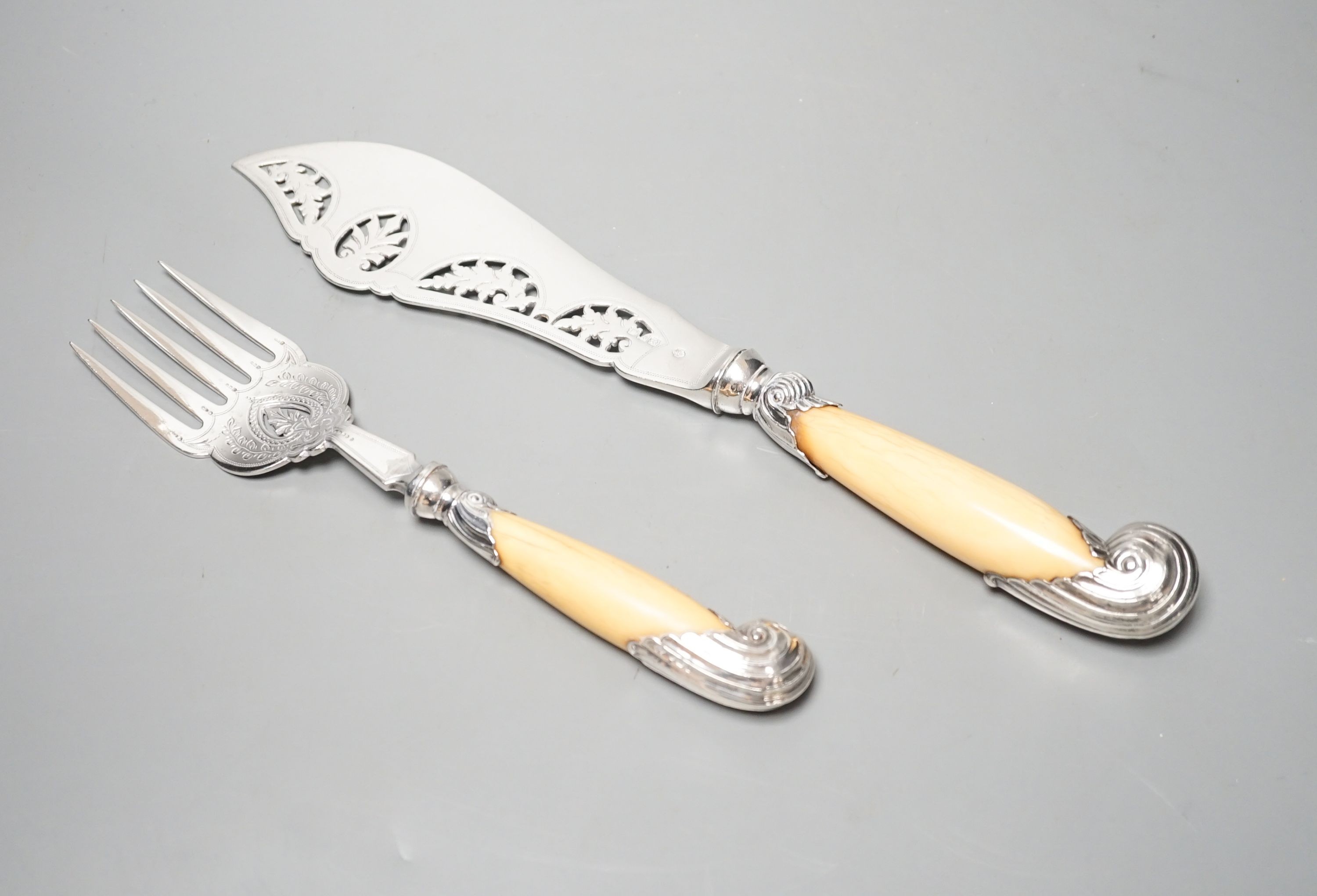 A pair of late Victorian ivory pistol handled silver fish servers, William Hutton & Sons, London, 1896, knife 33.2cm.